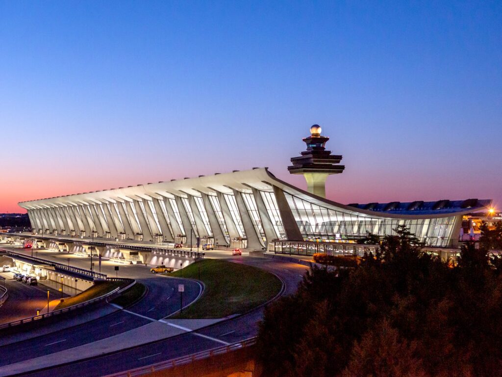 A view of an airport terminal at dusk.