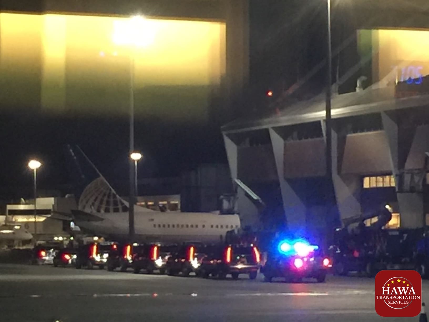Police vehicle with flashing lights at airport
